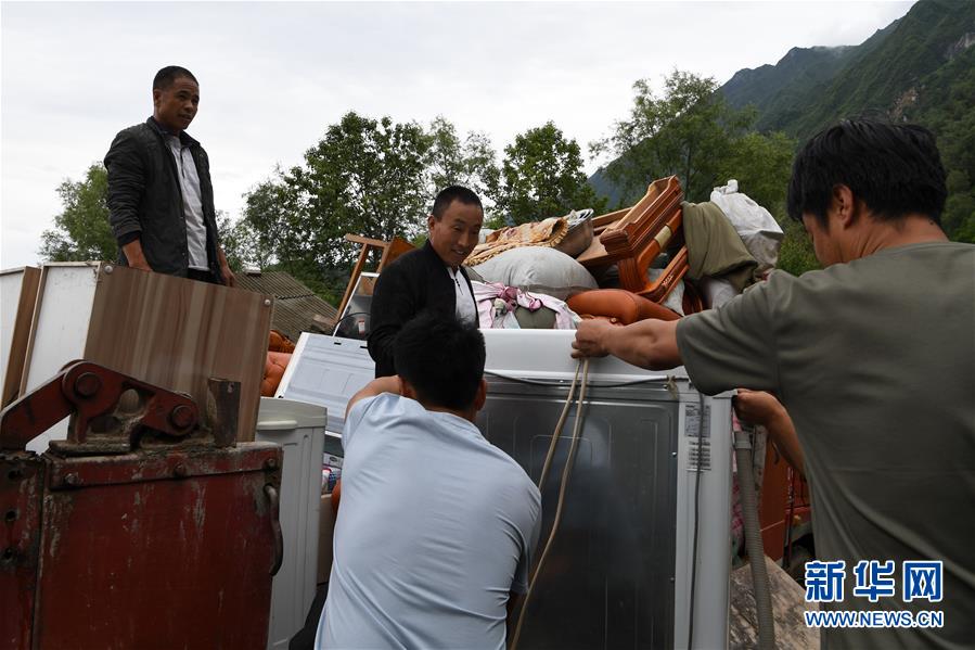 （新華全媒+）（9）千里“挪窩”，踏實開啟新生活